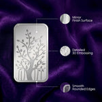 Metallic decorative panel with tree design on a purple fabric background